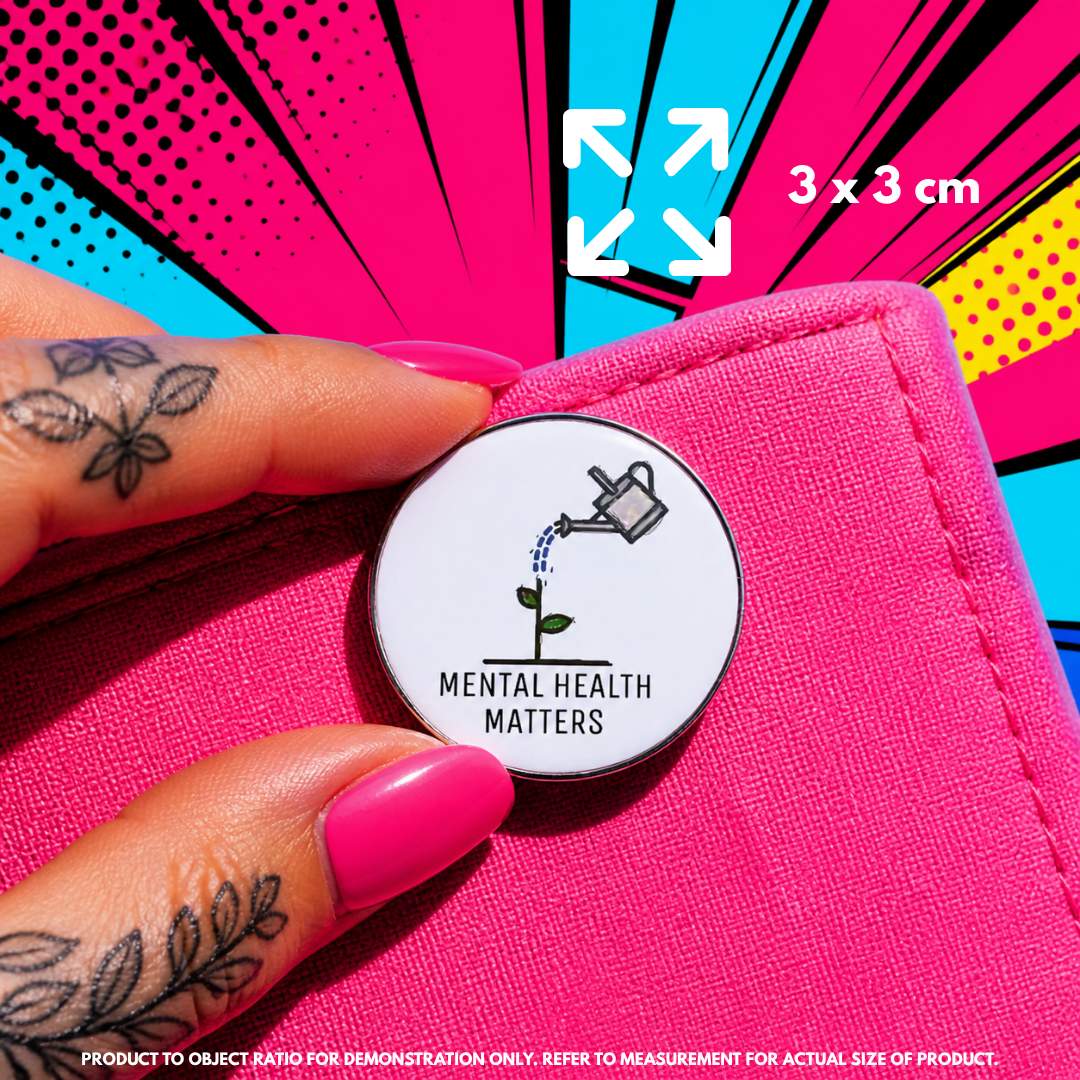 Person holding "Mental Health Matters" enamel pin showing 3×3cm size