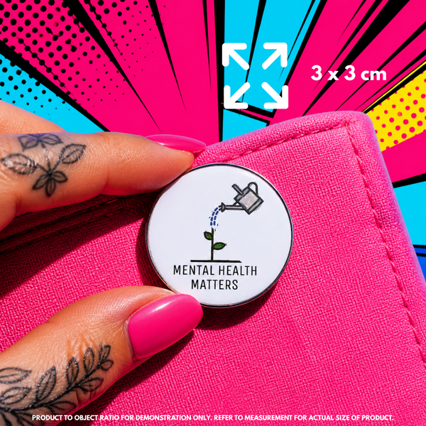 Person holding "Mental Health Matters" enamel pin showing 3×3cm size
