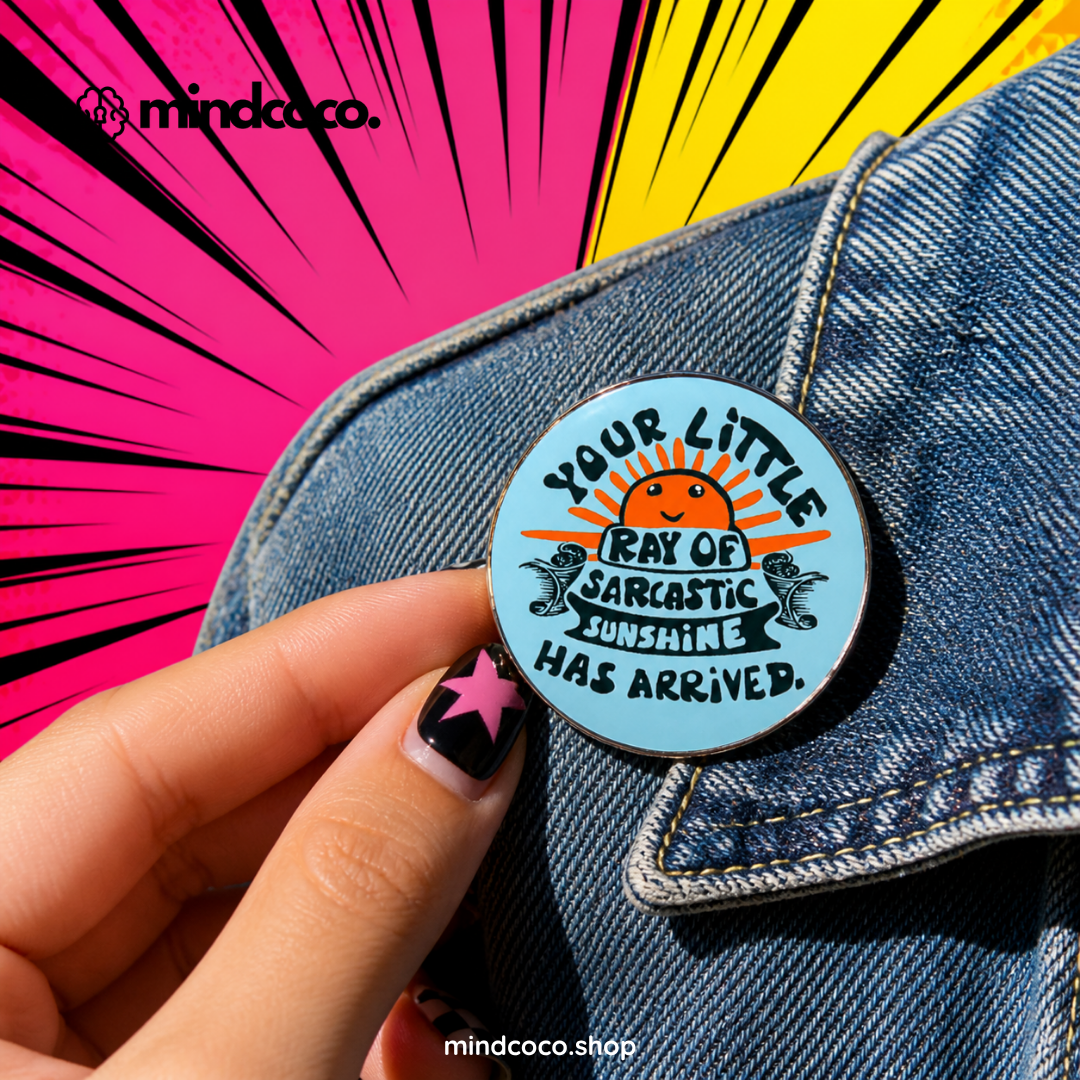 "Sarcastic Sunshine" enamel pin – lifestyle flat lay, neurodivergent and mental health humour