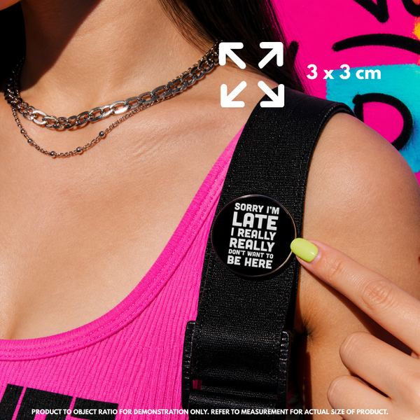 Person holding "Don't Want To Be Here" enamel pin showing 3×3cm size