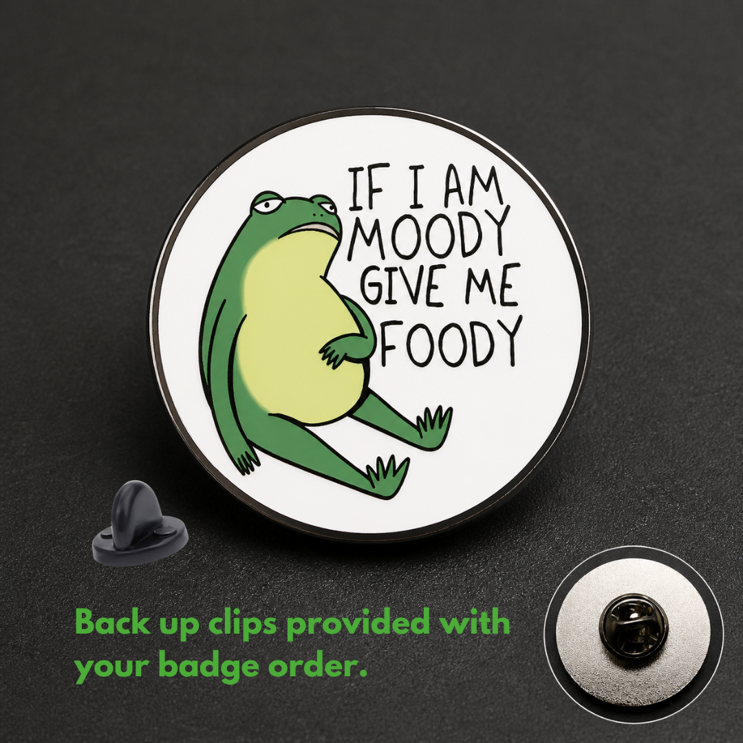 "If Moody Give Foody" enamel pin worn on jacket – neurodivergent and mental health humour