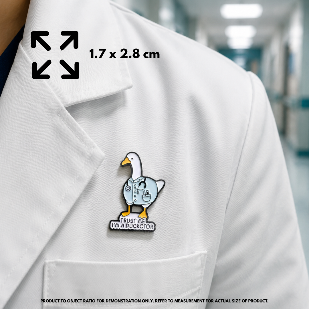 Person holding "I'm A Duckctor" enamel pin showing 3×3cm size