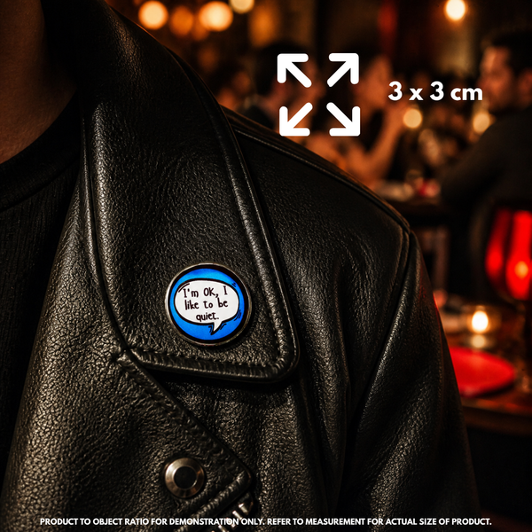 Person holding "I'm OK, I Like to Be Quiet" enamel pin showing 3×3cm size