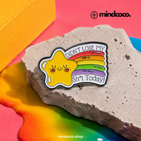 "Didn" enamel pin – lifestyle flat lay, neurodivergent and mental health humour
