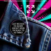 Person holding "Awake but Not Ready" enamel pin showing 3×3cm size