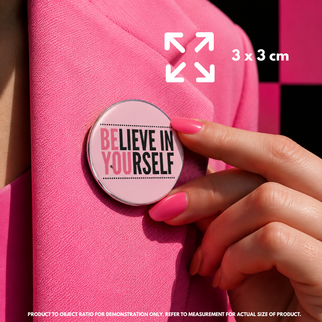 Person holding "Believe in Yourself" enamel pin showing 3×3cm size