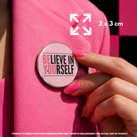 Person holding "Believe in Yourself" enamel pin showing 3×3cm size