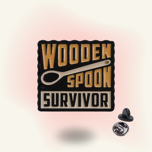 "Wooden Spoon Survivor" enamel pin – Childhood Trauma Humor