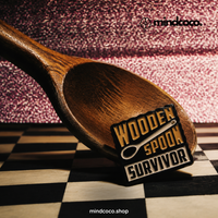 "Wooden Spoon Survivor" enamel pin – lifestyle flat lay, neurodivergent and mental health humour