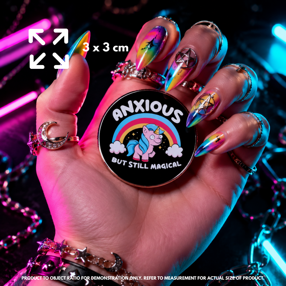 Person holding "Anxious Unicorn" enamel pin showing 3×3cm size
