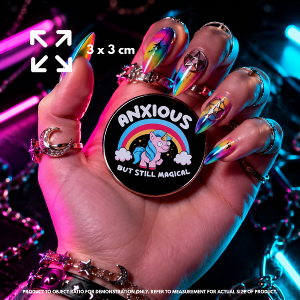 Person holding "Anxious Unicorn" enamel pin showing 3×3cm size