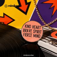 "Kind Heart, Brave Spirit, Fierce Mind" enamel pin – lifestyle flat lay, neurodivergent and mental health humour