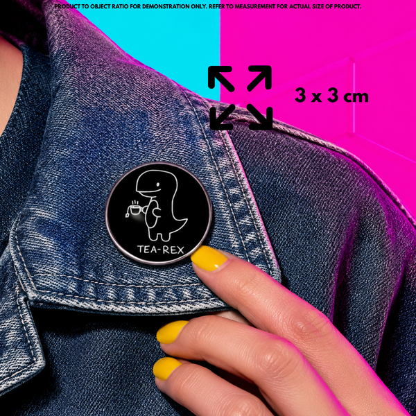 Person holding "Tea-Rex" enamel pin showing 3×3cm size