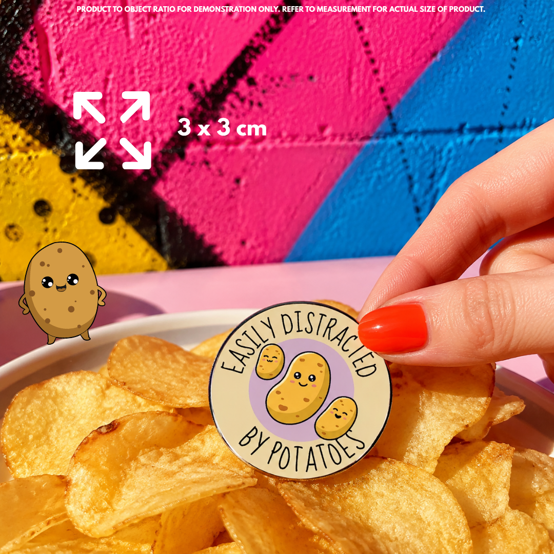Person holding "Easily Distracted By Potato" enamel pin showing 3×3cm size
