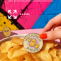 Person holding "Easily Distracted By Potato" enamel pin showing 3×3cm size