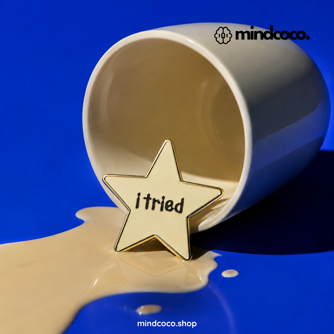 "I Tried" enamel pin – lifestyle flat lay, neurodivergent and mental health humour