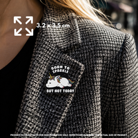 Person holding "Born To Sparkle, But Not Today" enamel pin showing 3×3cm size