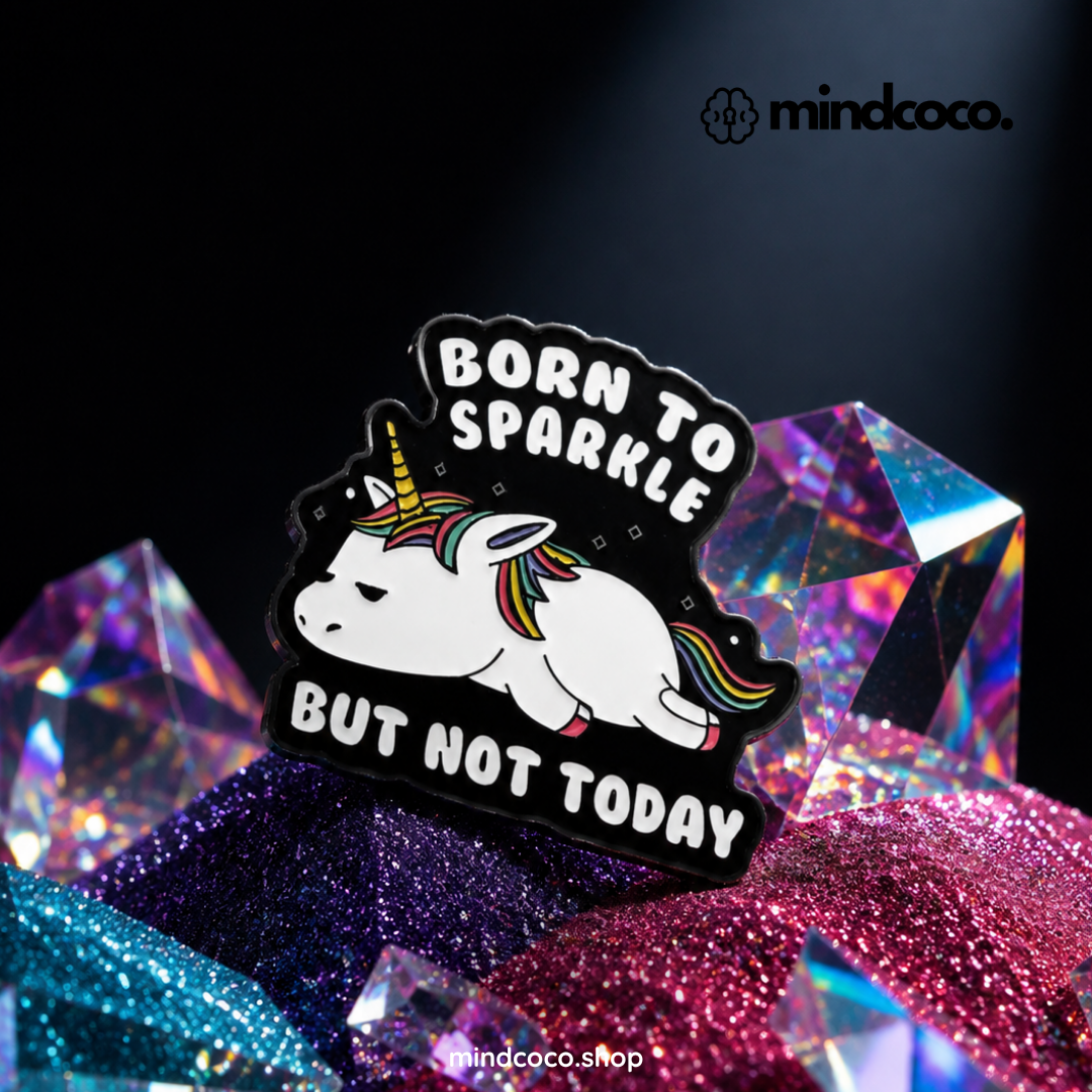 "Born To Sparkle, But Not Today" enamel pin – lifestyle flat lay, neurodivergent and mental health humour