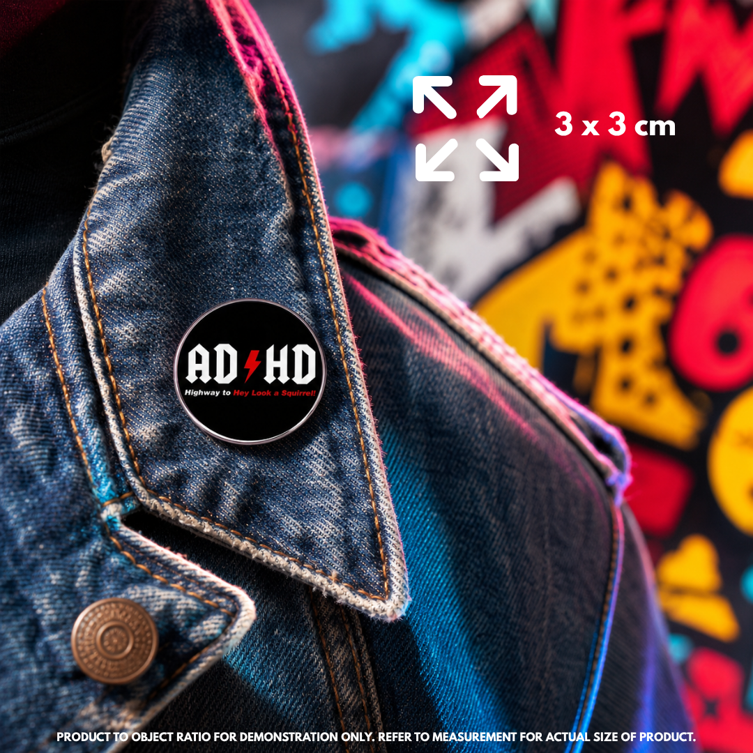 Person holding "ADHD Highway to Hey Look a Squirrel" enamel pin showing 3×3cm size