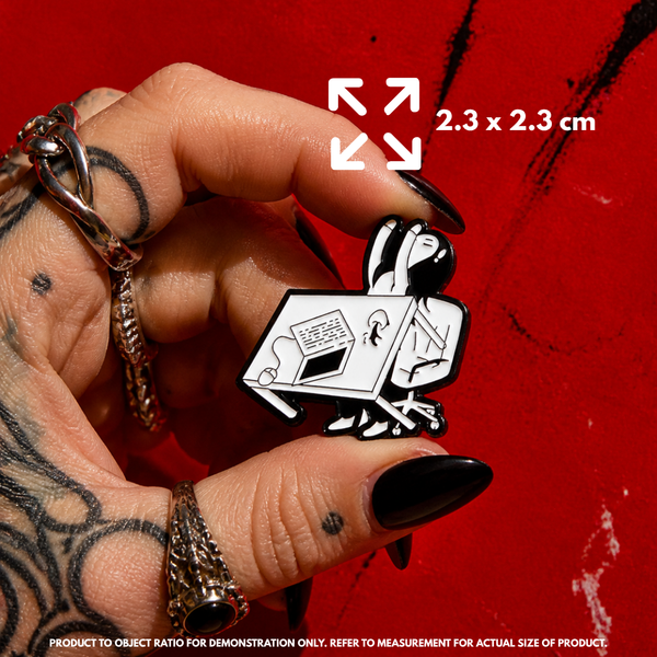 Person holding "Enough is Enough" enamel pin showing 3×3cm size