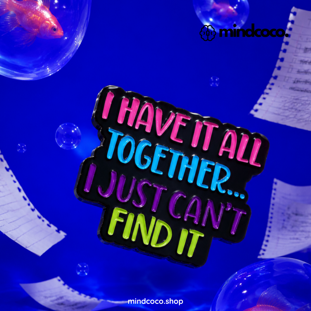 "I Have It All Together" enamel pin – lifestyle flat lay, neurodivergent and mental health humour