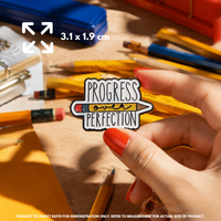 Person holding "Progress Over Perfection" enamel pin showing 3×3cm size