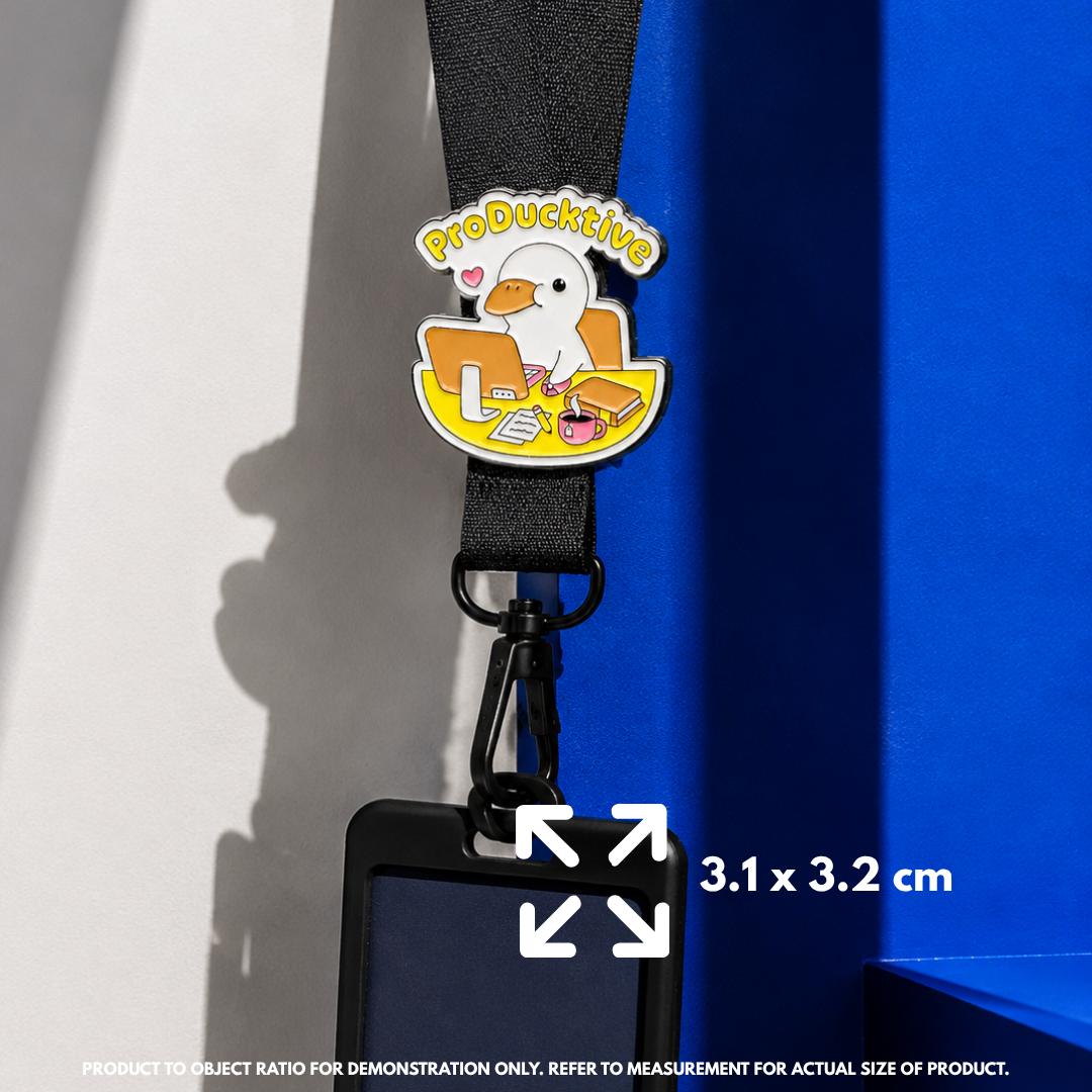 Person holding "ProDucktive" enamel pin showing 3×3cm size