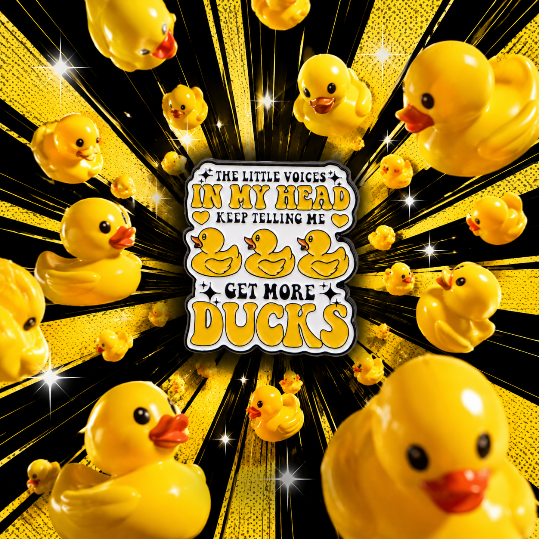 "Get More DUCKS" enamel pin – lifestyle flat lay, neurodivergent and mental health humour
