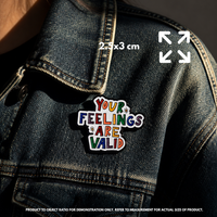Person holding "Your Feelings Are Valid" enamel pin showing 3×3cm size