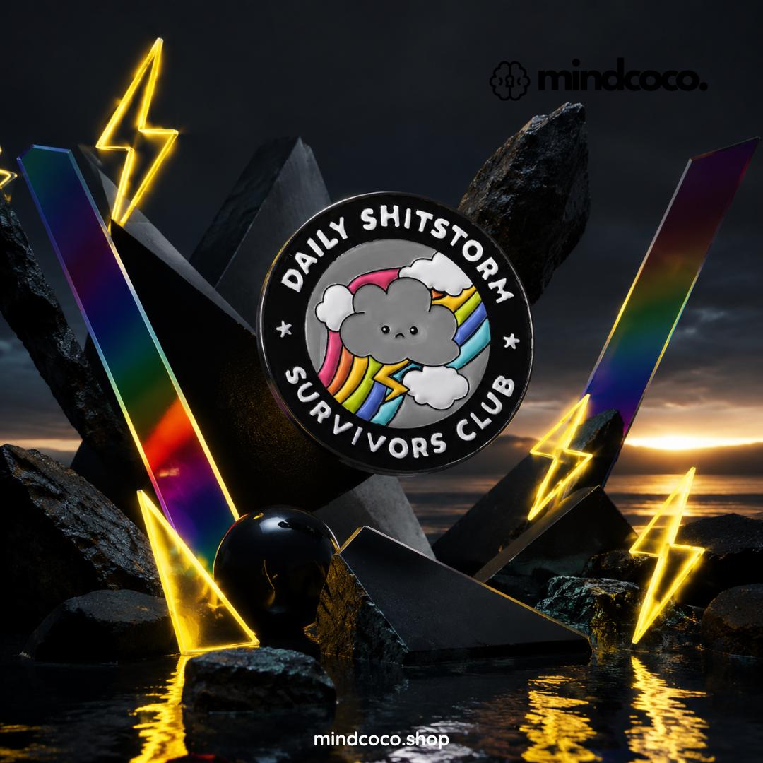 "Daily Shitstorm Survivors Club" enamel pin – lifestyle flat lay, neurodivergent and mental health humour