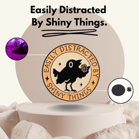 “Easily Distracted by Shiny Things" - Communication Pin Badge