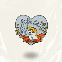 MindCoco "Be the Person Your Dog Thinks You Are" Pin: A wholesome heart-shaped enamel badge featuring a hand-drawn dog illustration on a light blue background. This sentimental accessory serves as a neurodivergent-friendly tool for self-compassion and mental health validation, celebrating unconditional love.