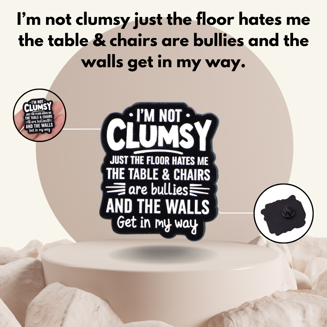 MindCoco "Clumsy Floor" Pin Infographic: A technical product reference highlighting its larger $3.1 \times 3.6$ cm size for clear readability. The infographic showcases the clean, bold design and the secure black rubber clutch backing, making it a perfect survival gift for the spatially challenged.
