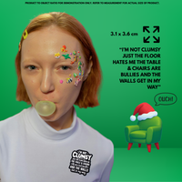 MindCoco Clumsiness Truth Bomb Badge: A minimalist text-focused enamel pin that humorously blames hostile environments for mystery bruises. Designed for neurodivergent self-validation, it shifts the focus from "clumsy" to a playful "the floor hates me" narrative for those with poor depth perception.