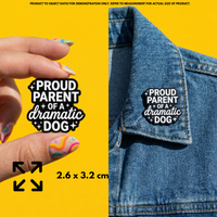 Person holding "Proud Parent of a Dramatic Dog" enamel pin showing 3×3cm size