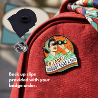 "OH, LOOK! NOBODY GIVES A SHIT" enamel pin worn on jacket – neurodivergent and mental health humour