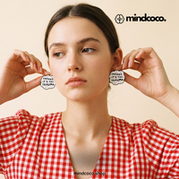 "Thanks It" enamel pin – lifestyle flat lay, neurodivergent and mental health humour