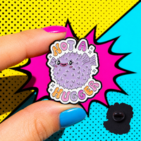 "Not A Hugger" enamel pin worn on jacket – neurodivergent and mental health humour