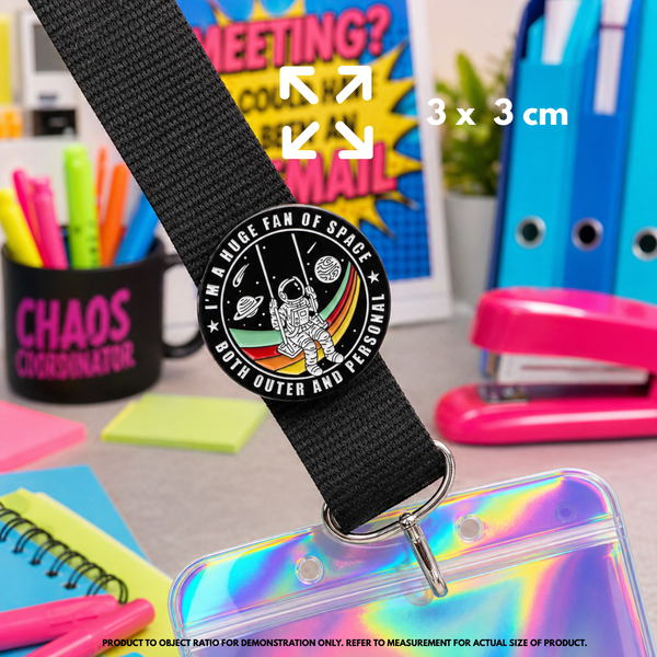 Person holding "Fan of Space" enamel pin showing 3×3cm size