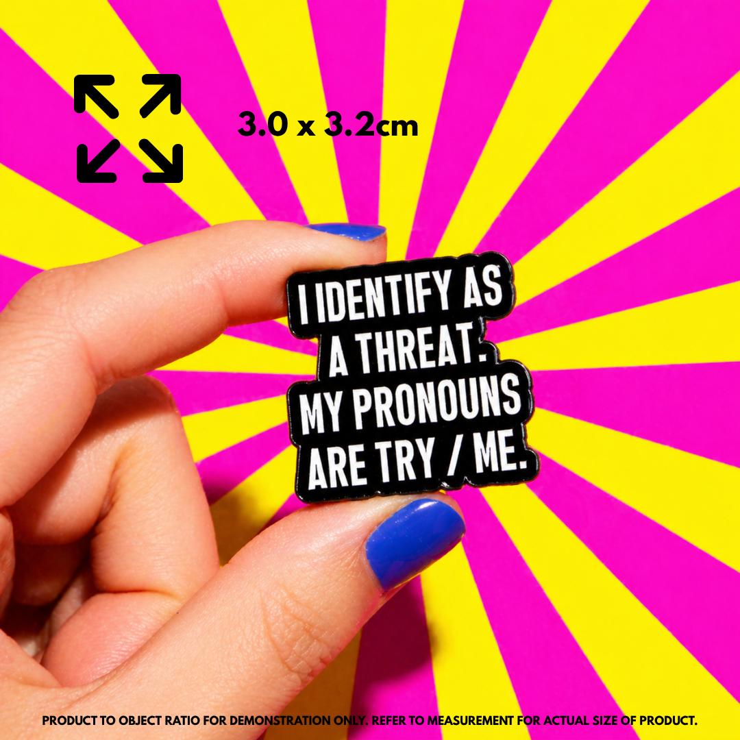 Person holding "Pronouns: Try Me" enamel pin showing 3×3cm size