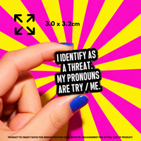 Person holding "Pronouns: Try Me" enamel pin showing 3×3cm size