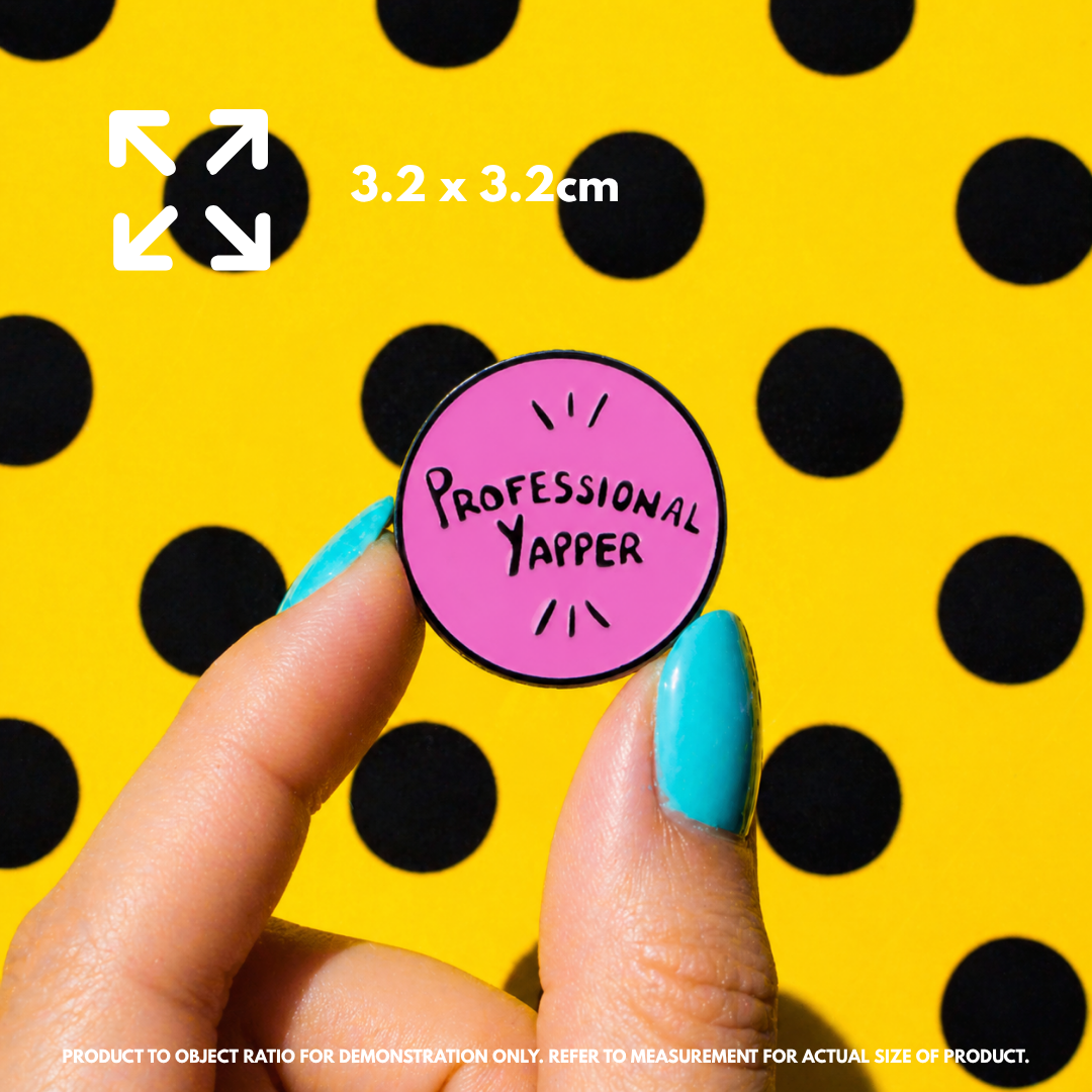 Person holding "Professional Yapper" enamel pin showing 3×3cm size