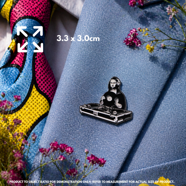 Person holding "DJ Mona Lisa" enamel pin showing 3×3cm size