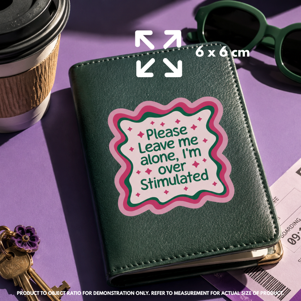 Person holding "Please Leave me alone" vinyl sticker showing 7.6×7.6cm size