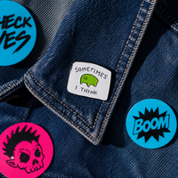 "Sometimes I Think" enamel pin – lifestyle flat lay, neurodivergent and mental health humour